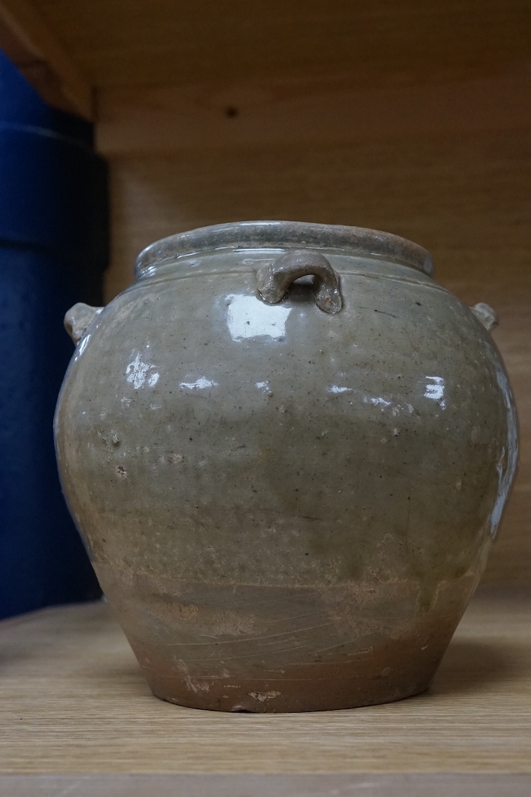 A Chinese olive green glazed jar, Tang Dynasty, 13cm